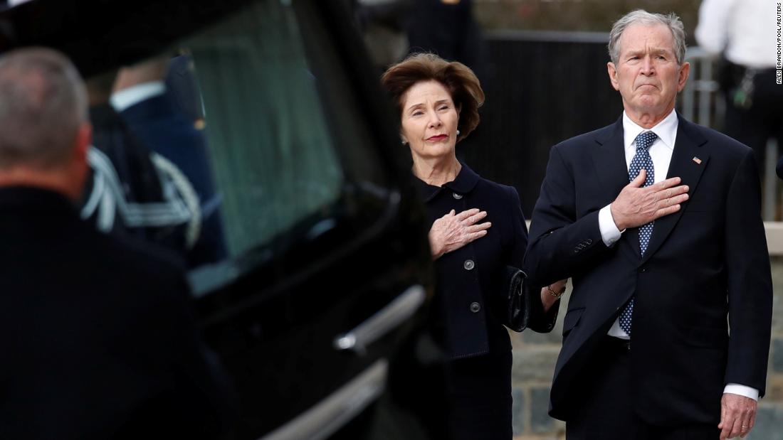 George W. Bush and his wife, Laura, attend the state funeral.