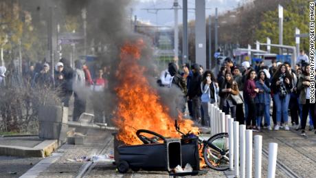 High school students set a barricade on fire to block the tramway during a demonstration Wednesday against French government education reforms in Bordeaux, southwestern France.