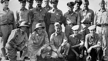 A 1944 portrait of the officers of the USS Finback and some US Navy pilots and crew rescued by the Finback. Kneeling second from the left is Ensign George Bush, whose bomber was shot down by the Japanese near the Bonin Islands. 