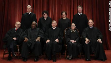 WASHINGTON, DC - NOVEMBER 30: United States Supreme Court (Front L-R) Associate Justice Stephen Breyer, Associate Justice Clarence Thomas, Chief Justice John Roberts, Associate Justice Ruth Bader Ginsburg, Associate Justice Samuel Alito, Jr., (Back L-R) Associate Justice Neil Gorsuch, Associate Justice Sonia Sotomayor, Associate Justice Elena Kagan and Associate Justice Brett Kavanaugh pose for their official portrait at the in the East Conference Room at the Supreme Court building November 30, 2018 in Washington, DC. Earlier this month, Chief Justice Roberts publicly defended the independence and integrity of the federal judiciary against President Trump after he called a judge who had ruled against his administration&#39;s asylum policy &quot;an Obama judge.&quot; &quot;We do not have Obama judges or Trump judges, Bush judges or Clinton judges,&quot; Roberts said in a statement. &quot;What we have is an extraordinary group of dedicated judges doing their level best to do equal right to those appearing before them. That independent judiciary is something we should all be thankful for.&quot; (Photo by Chip Somodevilla/Getty Images)