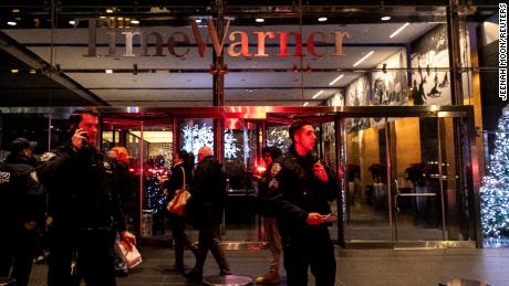 NYPD officers stand near the Time Warner Center Building after the building was evacuated due to a bomb threat, in the Manhattan borough of New York City, New York, U.S., December 6, 2018. REUTERS/Jeenah Moon