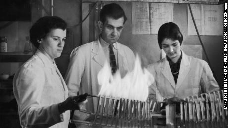 Scientists test cigarette filters with a smoking machine. 