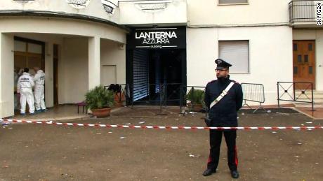 Forensic teams and police cordoned off the entrance of the Lanterna Azzurra nightclub on Saturday.