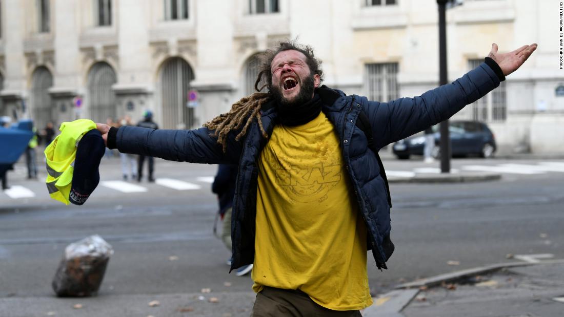 A protester reacts during clashes with police on December 8 in Paris.