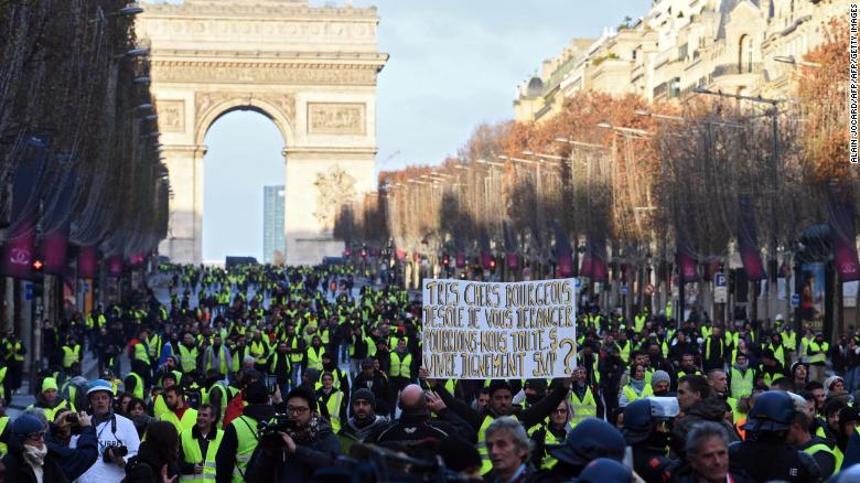 Yellow vest protesters gather near the Arc de Triomphe in Paris on Saturday.