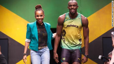 Cedella Marley (L) with Usain Bolt during the presentation of the Jamaican team&#39;s kit for London 2012.