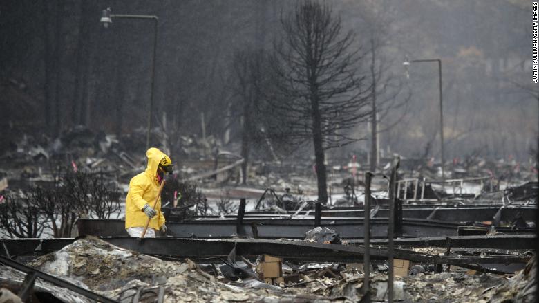 A search and rescue crew member searches for human remains at a mobile home park in Paradise which was destroyed on November 21, 2018. 