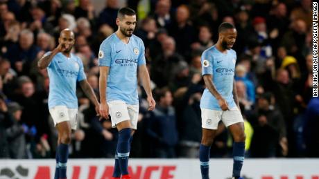 Manchester City midfielders Fabian Delph, Ilkay Gundogan and Raheem Sterling react after Chelsea scores its second goal.