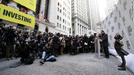   Fearless girl in her new home over the New York Stock Exchange 