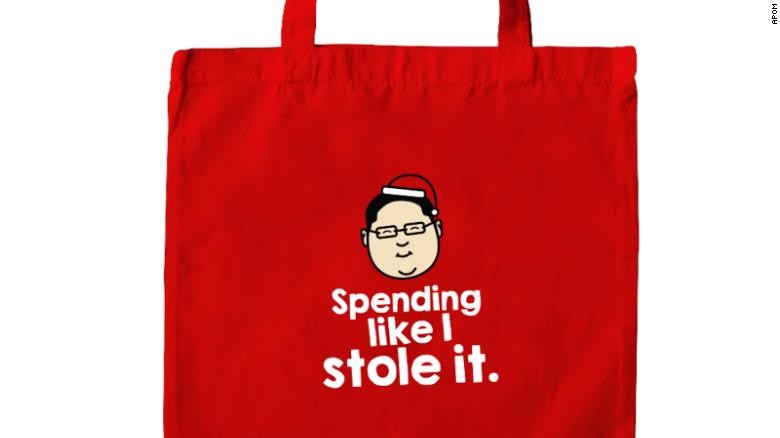 Detail of a tote bag, showing a caricature of Jho Low, the on-the-run financier accused of embezzling billions of dollars from Malaysia&#39;s sovereign wealth fund.