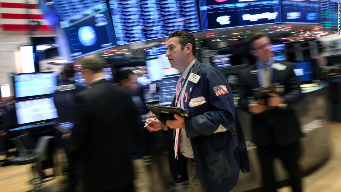 Dow surges to new record as Fed signals three rate cuts in 2024