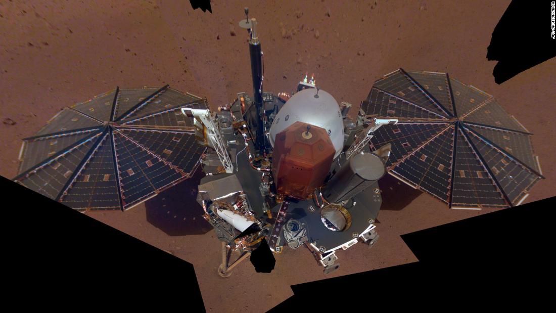 This is NASA InSight&#39;s first selfie on Mars. It displays the lander&#39;s solar panels and deck. On top of the deck are its science instruments, weather sensor booms and UHF antenna.