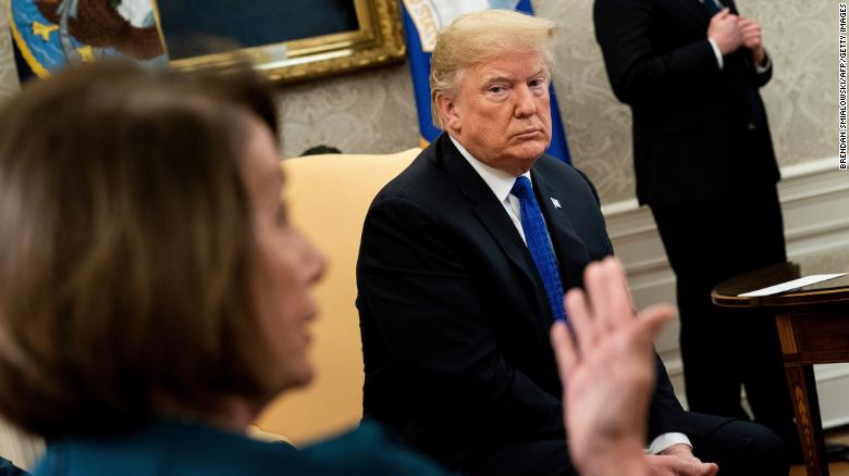 US President Donald Trump (R) listens while presumptive Speaker, House Minority Leader Nancy Pelosi (D-CA) makes a statement to the press before a meeting at the White House December 11, 2018 in Washington, DC. (Photo by Brendan Smialowski / AFP)        (Photo credit should read BRENDAN SMIALOWSKI/AFP/Getty Images)