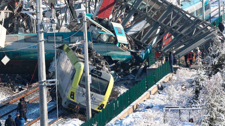 Members of rescue services work at the crash scene Thursday in Ankara.