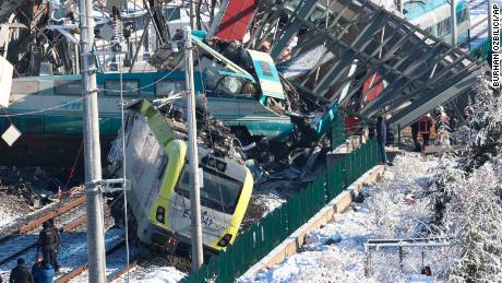 Members of rescue services work at the crash scene Thursday in Ankara.