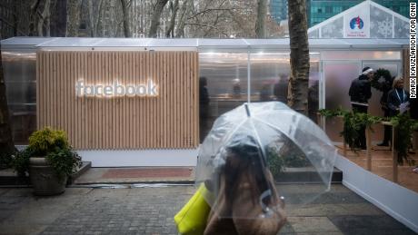 A woman passes by Facebook&#39;s first US-privacy pop-up at Bryant Park in New York on Thursday. 