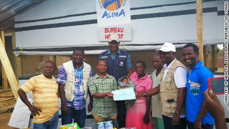 Born October 31, baby Bénédicte is the youngest survivor of Ebola. Seen here with her care givers.