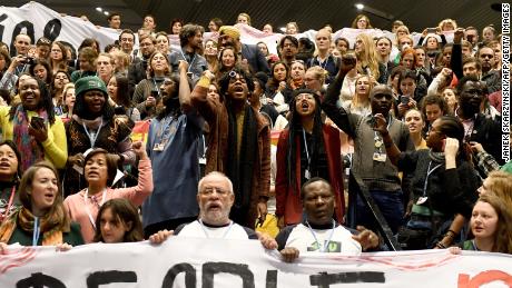 Members of the Global Campaign to Demand Climate Justice protest ahead of the final session of the COP24 summit on climate change in Katowice, Poland.