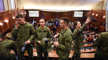 Members of the Kosovo Security Force attend the session at Kosovo parliament where lawmakers voted to create an army.