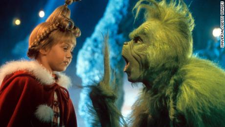 Taylor Momsen listening to Jim Carrey in a scene from the film 'How The Grinch Stole Christmas', 2000.