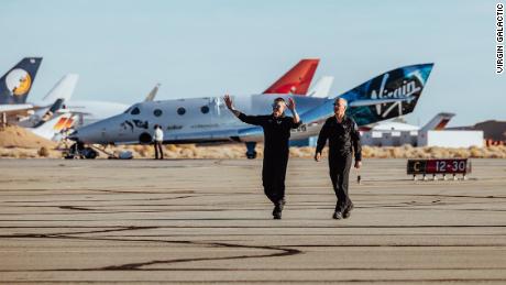 Mark "Forger" Stucky and Rick "CJ" Sturckow emerge from VSS Unity after landing.