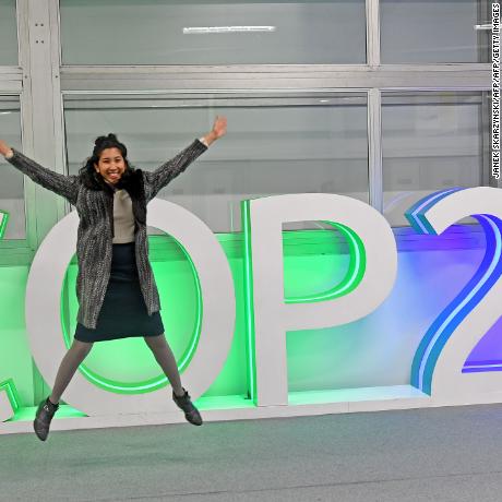A participant jumps for a picture at the COP24 climate talks in Katowice, Poland, on December 14.