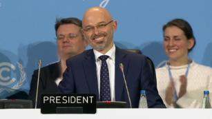Tense climate talks end in agreement