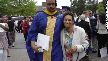 Jermaine McBean stands with his grandmother at his graduation in June 2007 at New York's Pace University.