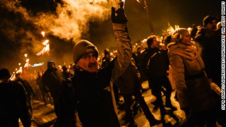 A protester seen holding a burning flare during the protest against on December 16. 