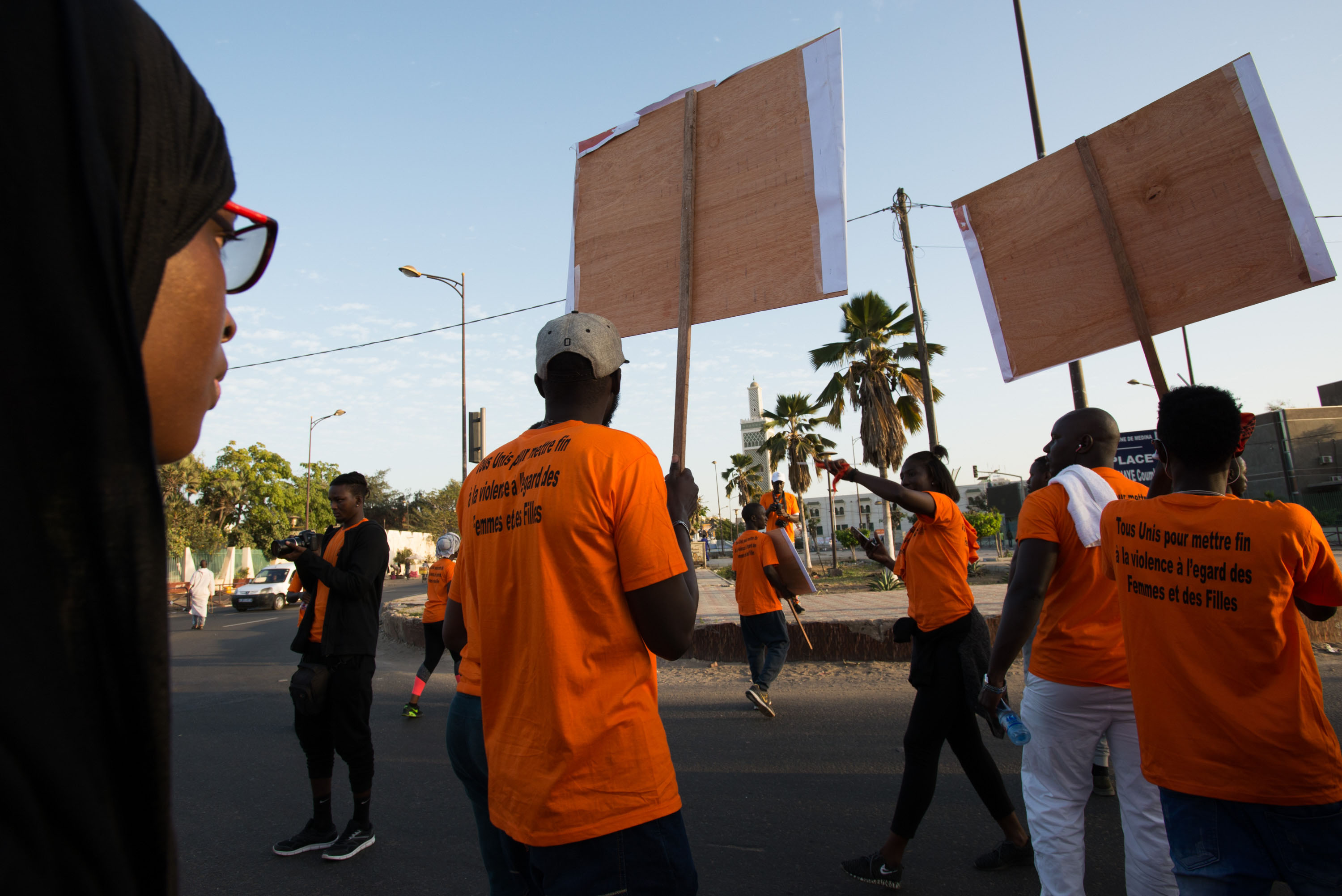 Demonstrators from various groups organizing to end violence against women march through central Dakar on Sunday, December 9.