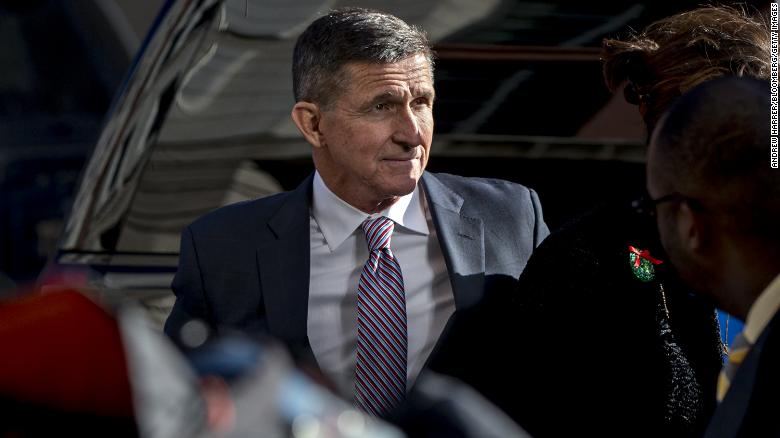 Michael Flynn, former U.S. national security adviser, center, arrives at federal court in Washington, D.C., U.S., on Tuesday, Dec. 18, 2018. President Donald Trump offered public well wishes to Flynn, hours before his former national security adviser is set to be sentenced for lying to investigators about his contacts during the 2016 campaign with the Russian ambassador. Photographer: Andrew Harrer/Bloomberg via Getty Images