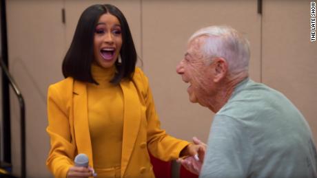 Cardi B reacts with surprise after a man asks her out at a senior center in Los Angeles.