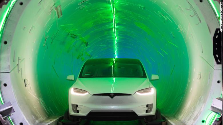 A Tesla sits at an entrance to the Boring Company&#39;s test tunnel.