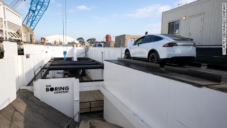 The Boring Company has dug an entrance to its test tunnel in a corner of SpaceX's parking lot.