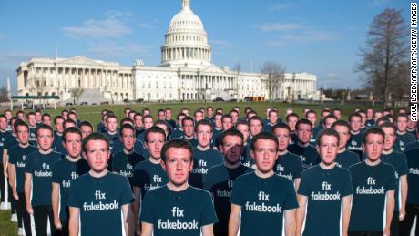 TOPSHOT - One hundred cardboard cutouts of Facebook founder and CEO Mark Zuckerberg stand outside the US Capitol in Washington, DC, April 10, 2018. - Advocacy group Avaaz is calling attention to what the groups says are hundreds of millions of fake accounts still spreading disinformation on Facebook. (Photo by SAUL LOEB / AFP)        (Photo credit should read SAUL LOEB/AFP/Getty Images)