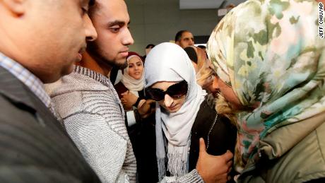 Shaima Swileh (center) arrived at San Francisco International Airport Wednesday night.