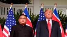 TOPSHOT - US President Donald Trump (R) poses with North Korea's leader Kim Jong Un (L) at the start of their historic US-North Korea summit, at the Capella Hotel on Sentosa island in Singapore on June 12, 2018. - Donald Trump and Kim Jong Un have become on June 12 the first sitting US and North Korean leaders to meet, shake hands and negotiate to end a decades-old nuclear stand-off. (Photo by SAUL LOEB / AFP)        (Photo credit should read SAUL LOEB/AFP/Getty Images)