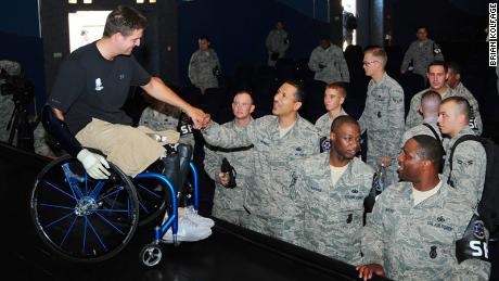 Brian Kolfage meets with American airmen at a military base in Germany in 2012.