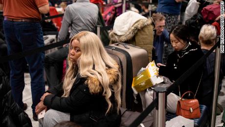 Passengers wait for announcements at Gatwick South Terminal.