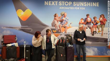 Passengers wait for announcements at Gatwick South Terminal on December 20, 2018.