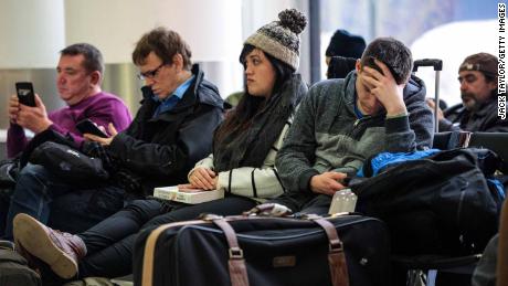 Passengers wait in the South Terminal building at London Gatwick Airport after flights resumed Friday.