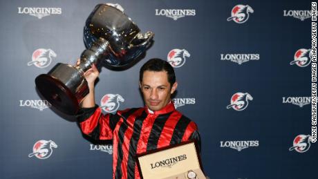 HONG KONG, HONG KONG - DECEMBER 05: Silvestre De Sousa representing Great Britain poses with the trophy after winning championship during the LONGINES International Jockeys&#39; Championship at Happy Valley Racecourse on December 05, 2018 in Hong Kong. (Photo by Vince Caligiuri/Getty Images)