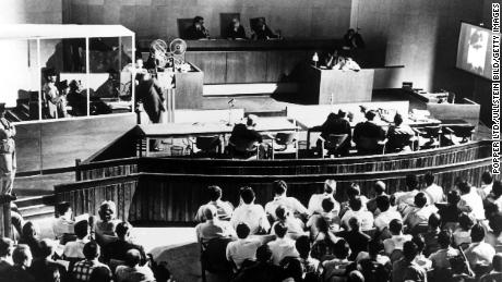 Adolf Eichmann, the Holocaust&#39;s &quot;architect,&quot; goes on trial in Jerusalem in 1961 after Israel captured him.