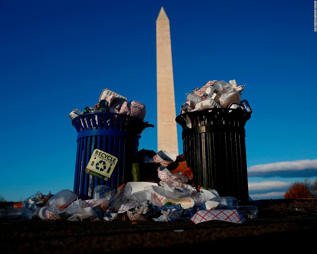 A public trash can spills over on Washington&#39;s Pennsylvania Avenue on Monday, December 24.