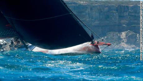 Reigning champion Comanche sails out of the Sydney Heads at the start of the 2018 Sydney Hobart yacht race. 