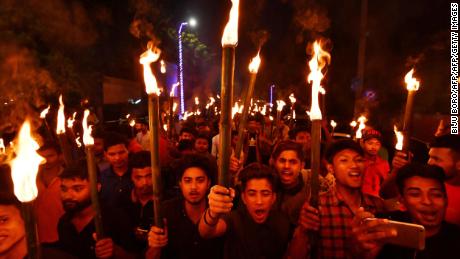 Activists of All Assam Students' Union (AASU) take part in a torch light procession in protest against the Citizenship (Amendment) Bill 2016 proposal to provide citizenship or stay rights to minorities from Bangladesh, Pakistan and Afghanistan in India, in Guwahati on May 14, 2018.