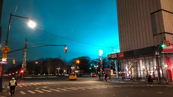 Manhattan's sky lights up in an eerie shade of blue Thursday night, as seen from Columbus Circle.