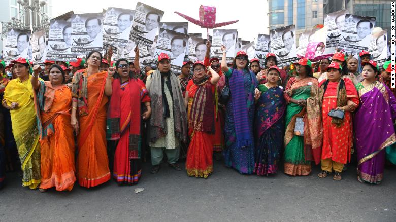 Supporters of the Bangladesh Awami League shout slogans while taking part in a rally ahead of December 30 general election vote, in Dhaka on December 27, 2018.