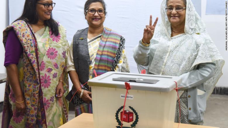 Bangladeshi Prime Minister Sheikh Hasina flashes the victory symbol after casting her vote in Dhaka on December 30, 2018. 
