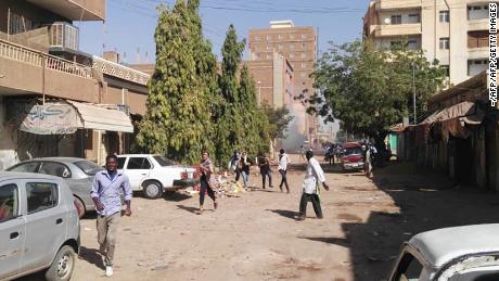 Sudanese protesters run away from tear gas during a demonstration in Khartoum on Monday. 